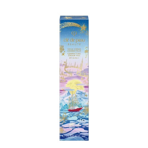 Photo of the 26 AW Holiday Collection limited-edition CORRECTING CREAM VEIL outer box. The package features an illustration of a red ship sailing in an icy sea under a full moon, decorated with a large gold shooting star at the top.